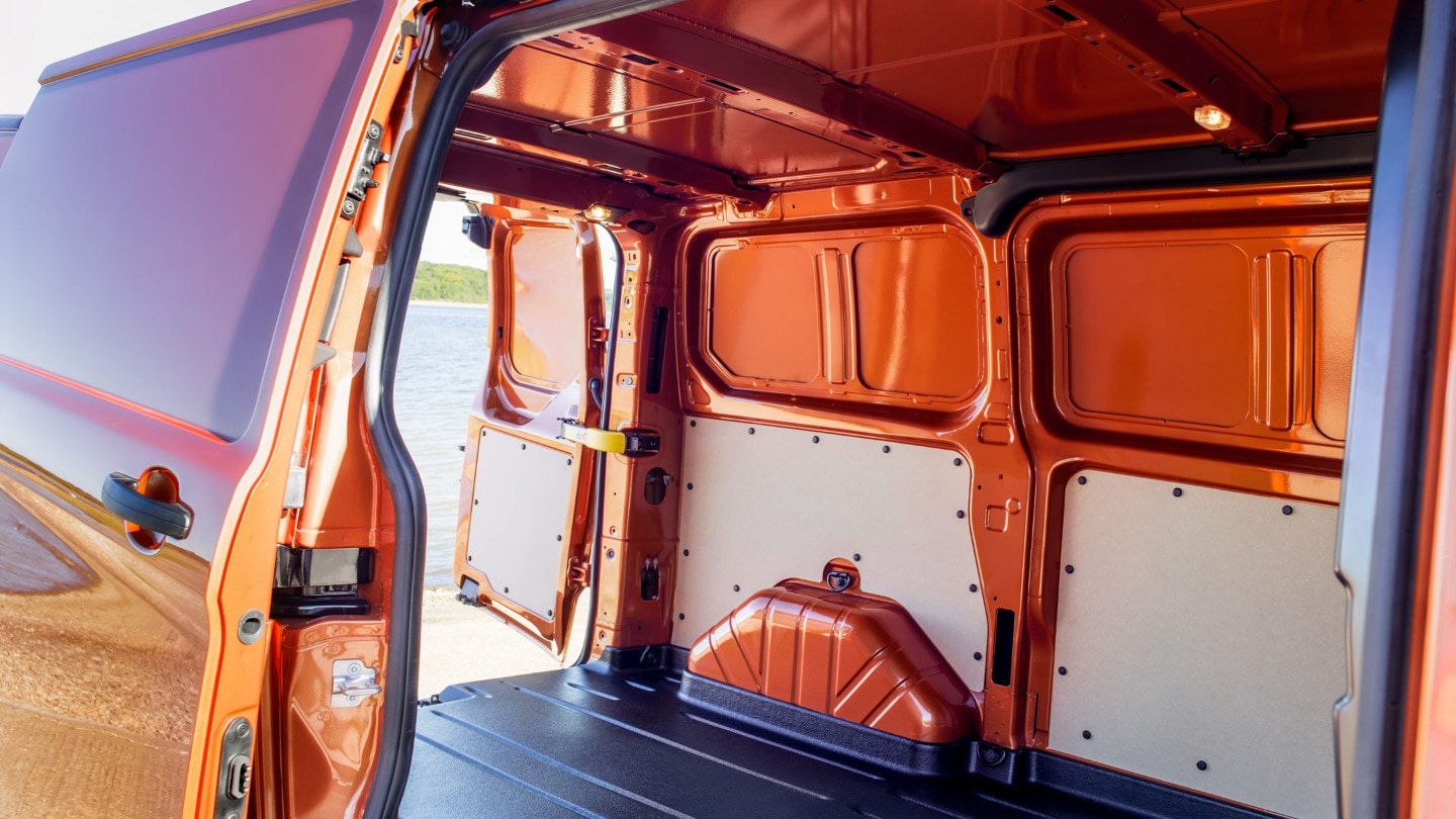 New Orange Ford Transit Custom open loadspace with side and rear doors