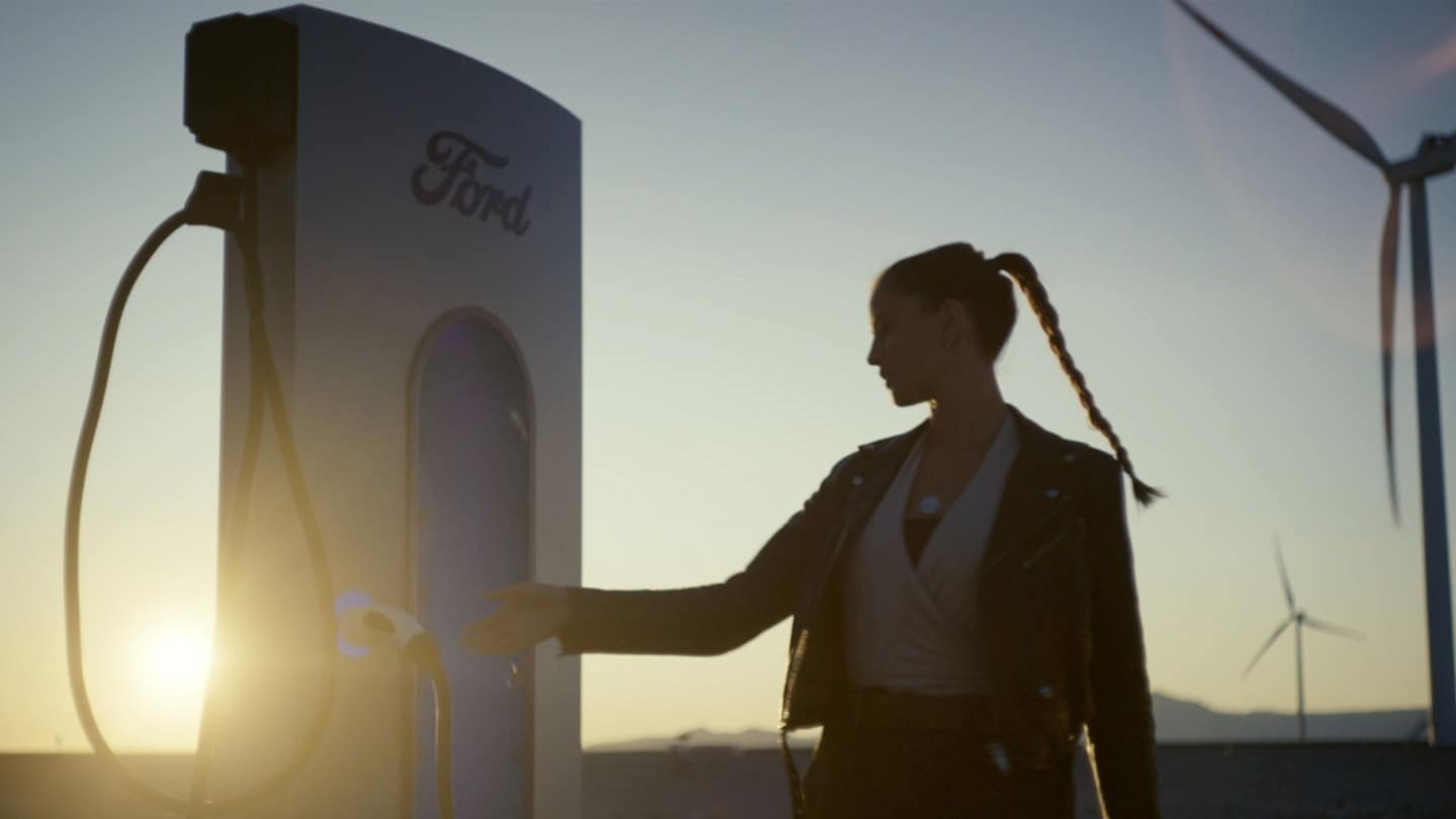 Lexie Limitless near an EV charger