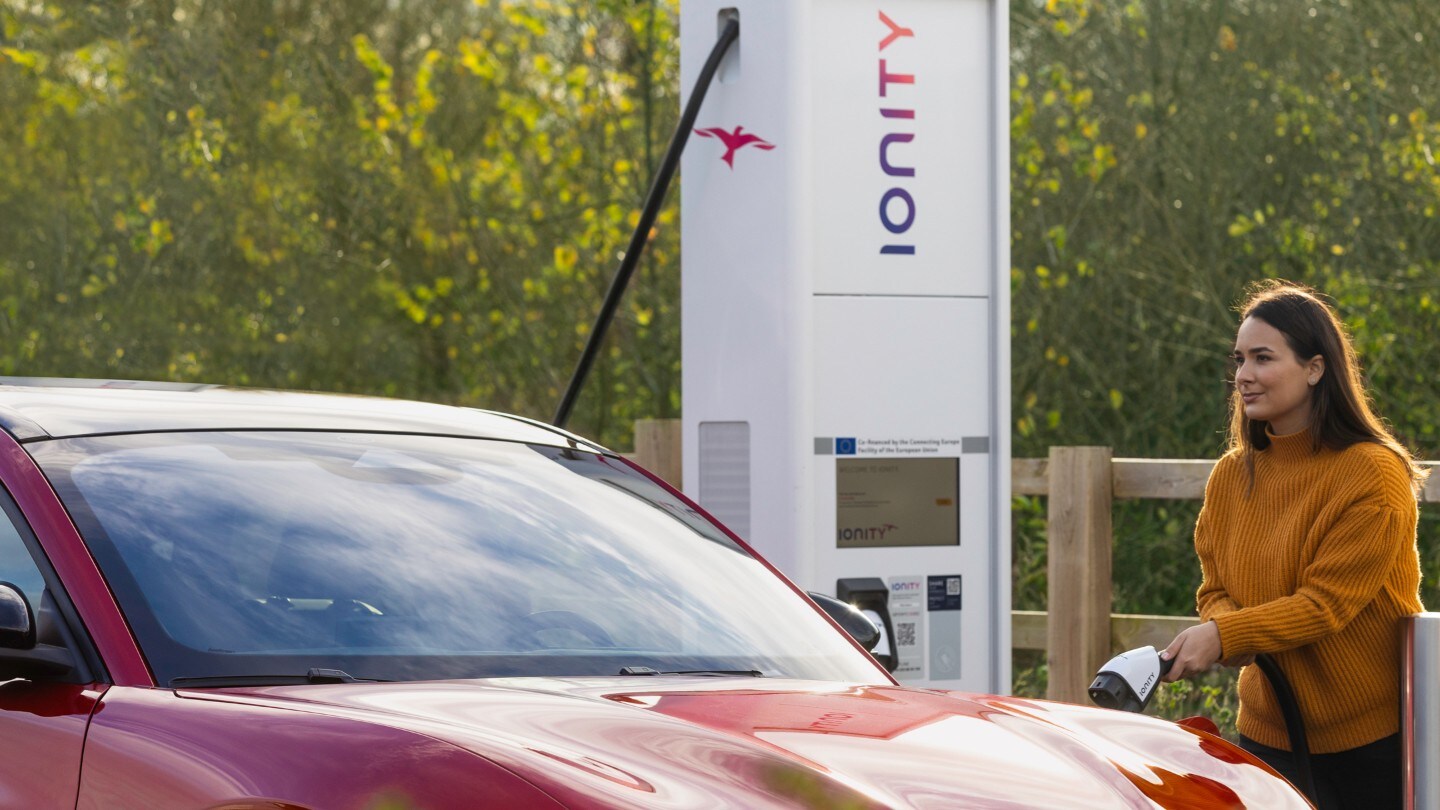 Silver Mustang Mach-E charging at an IONITY charging station