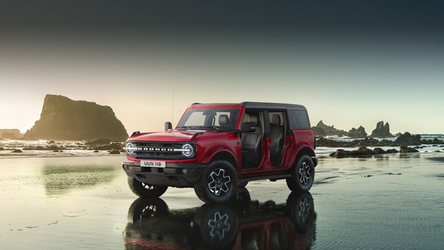 Ford Bronco parked on a beach