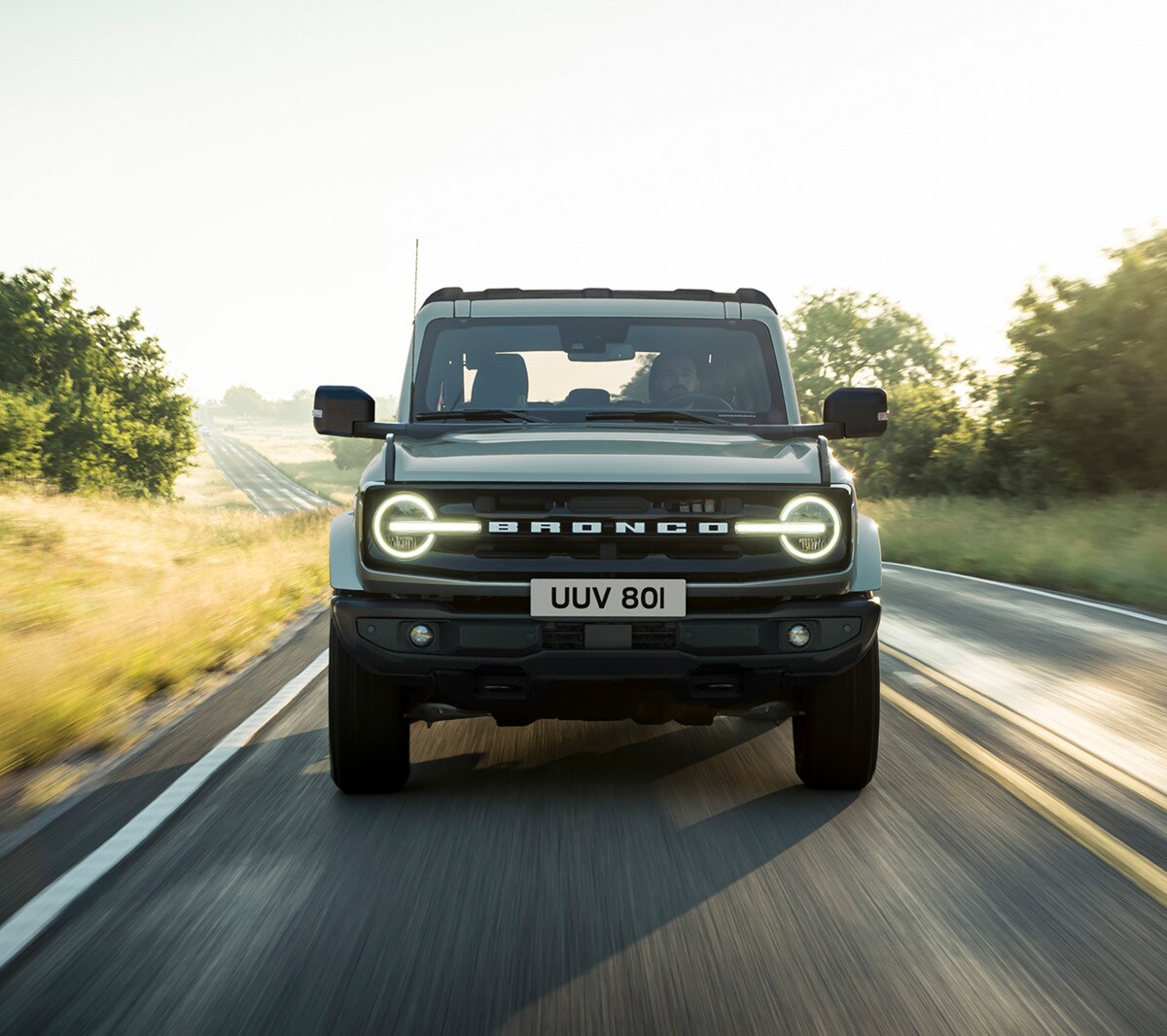 Ford Bronco driving along country road