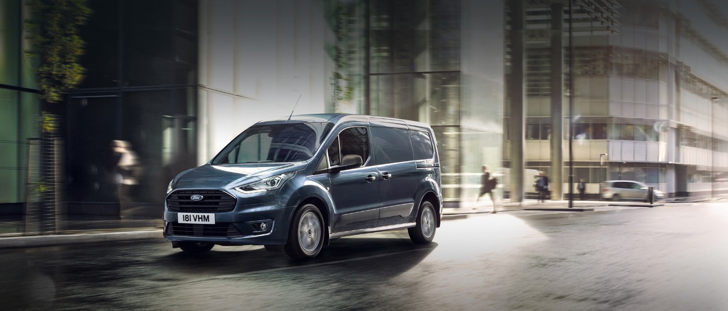 New Blue Ford Transit Connect driving in city