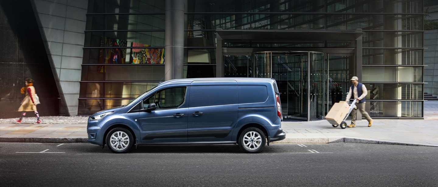 Blue Ford Transit Connect driving