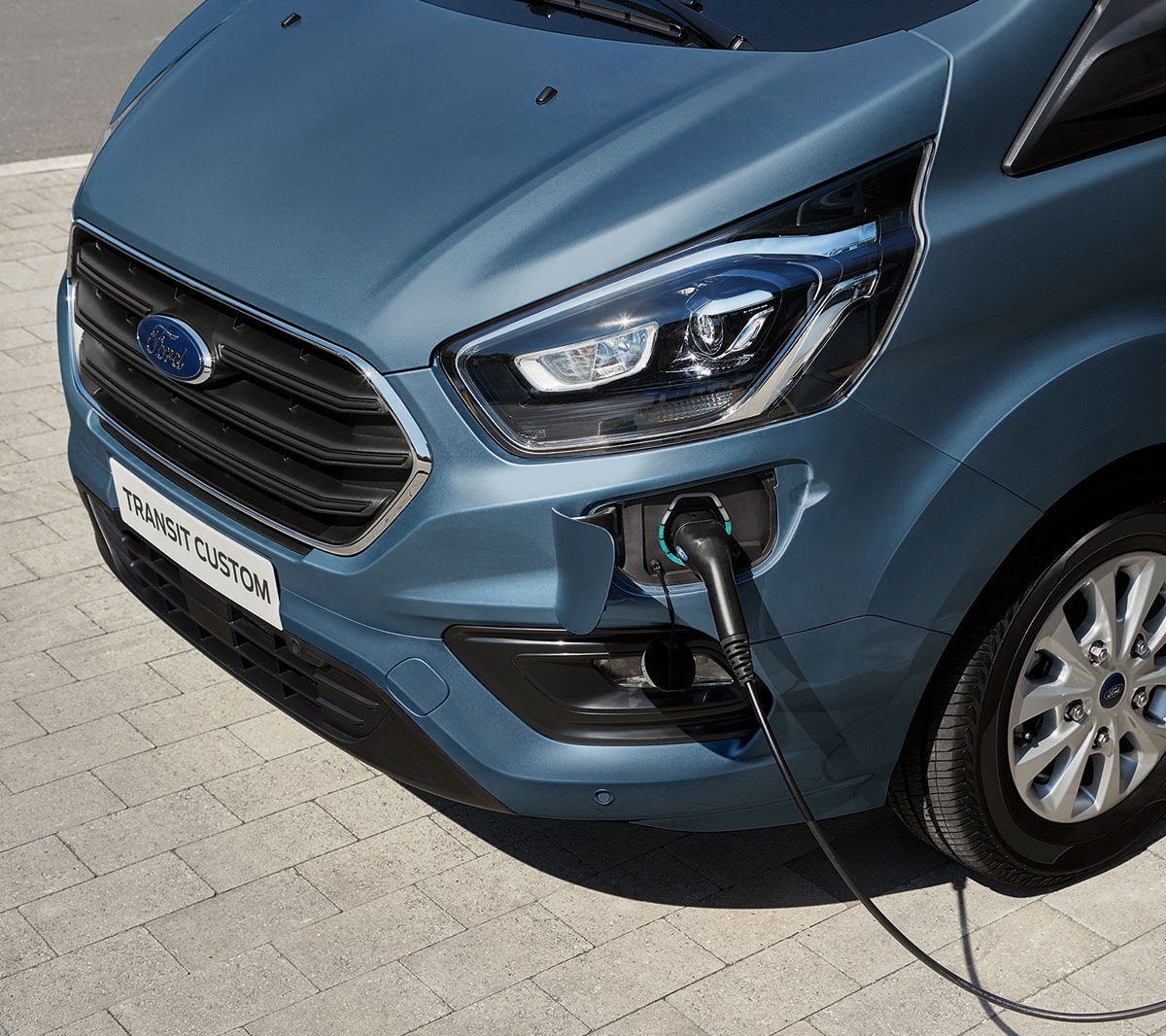 New Blue Ford Transit Custom PHEV charging port close-up