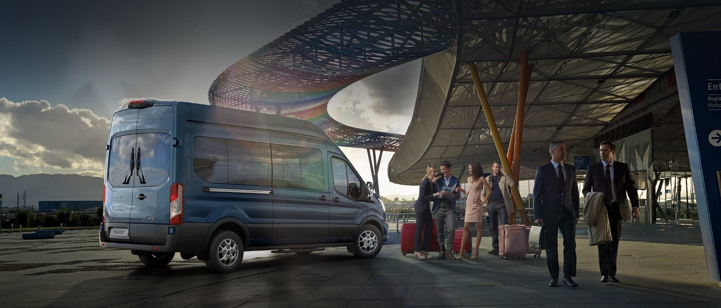All New Ford Transit Minibus rear view parked outside airport