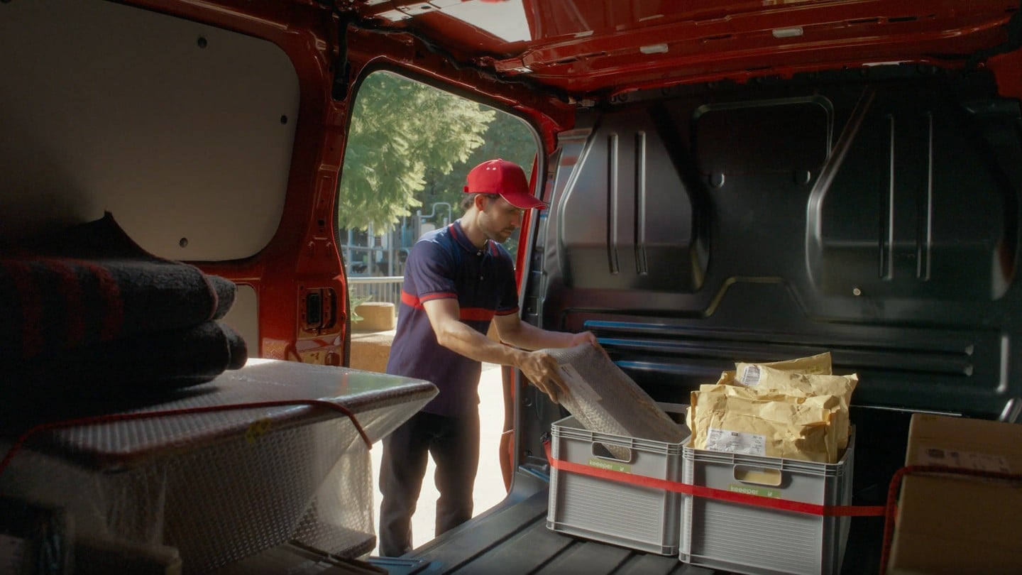 Man loading Transit Custom Plug-In Hybrid Van