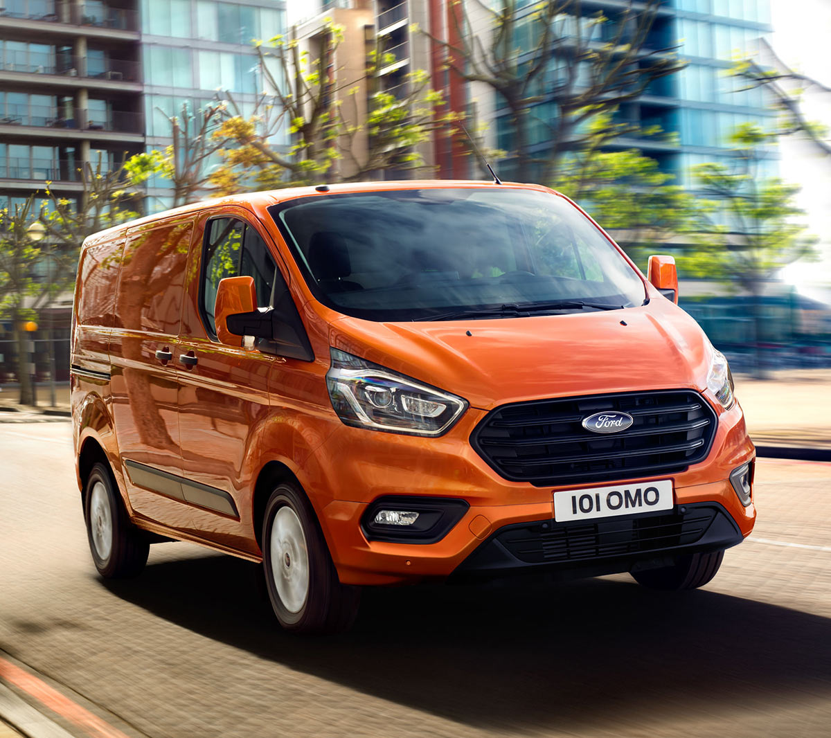 New Orange Ford Transit Custom driving