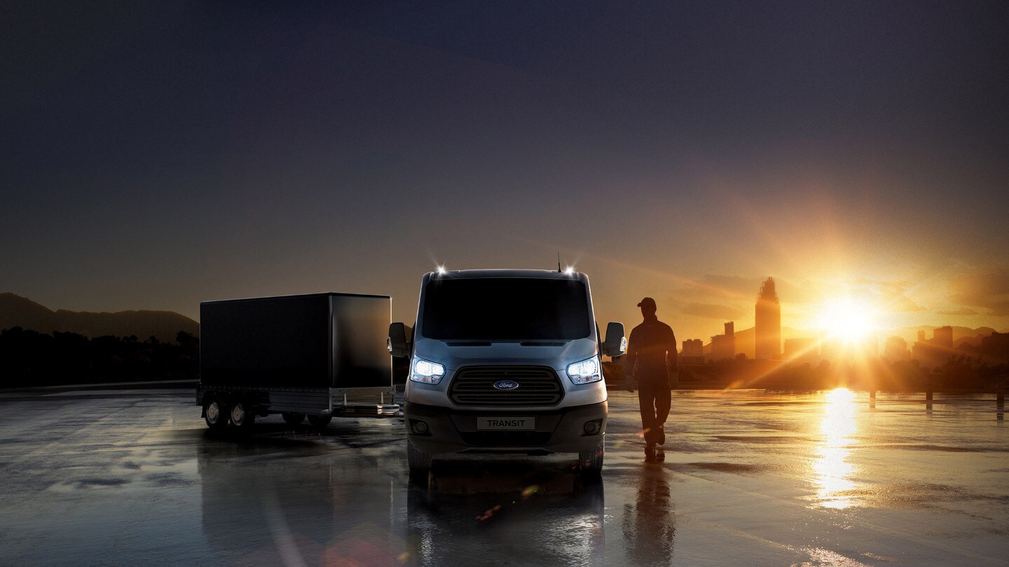 Ford Transit with trailer at sunset backdrop