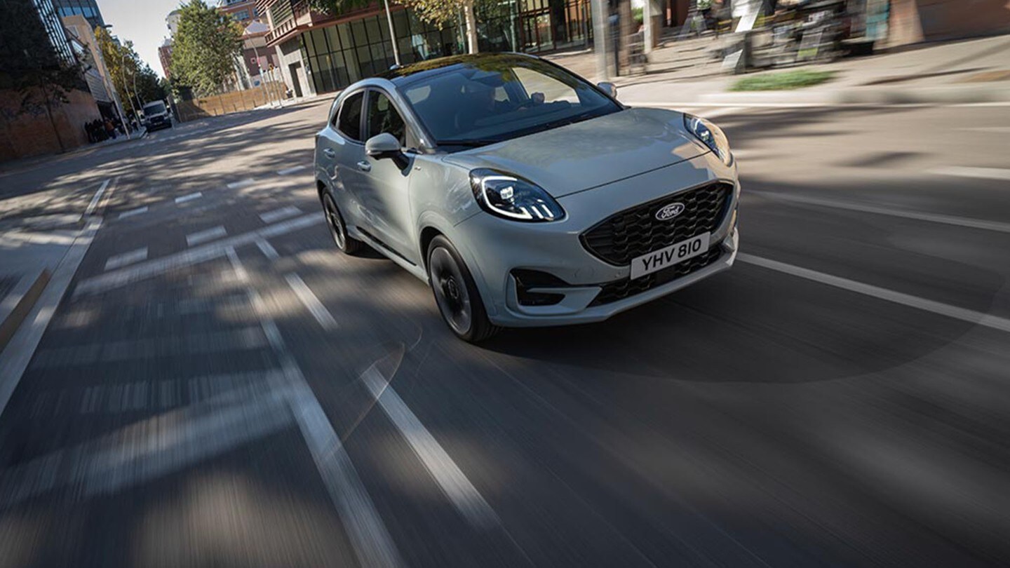 Man holding the phone inside the Ford car with SYNC technology